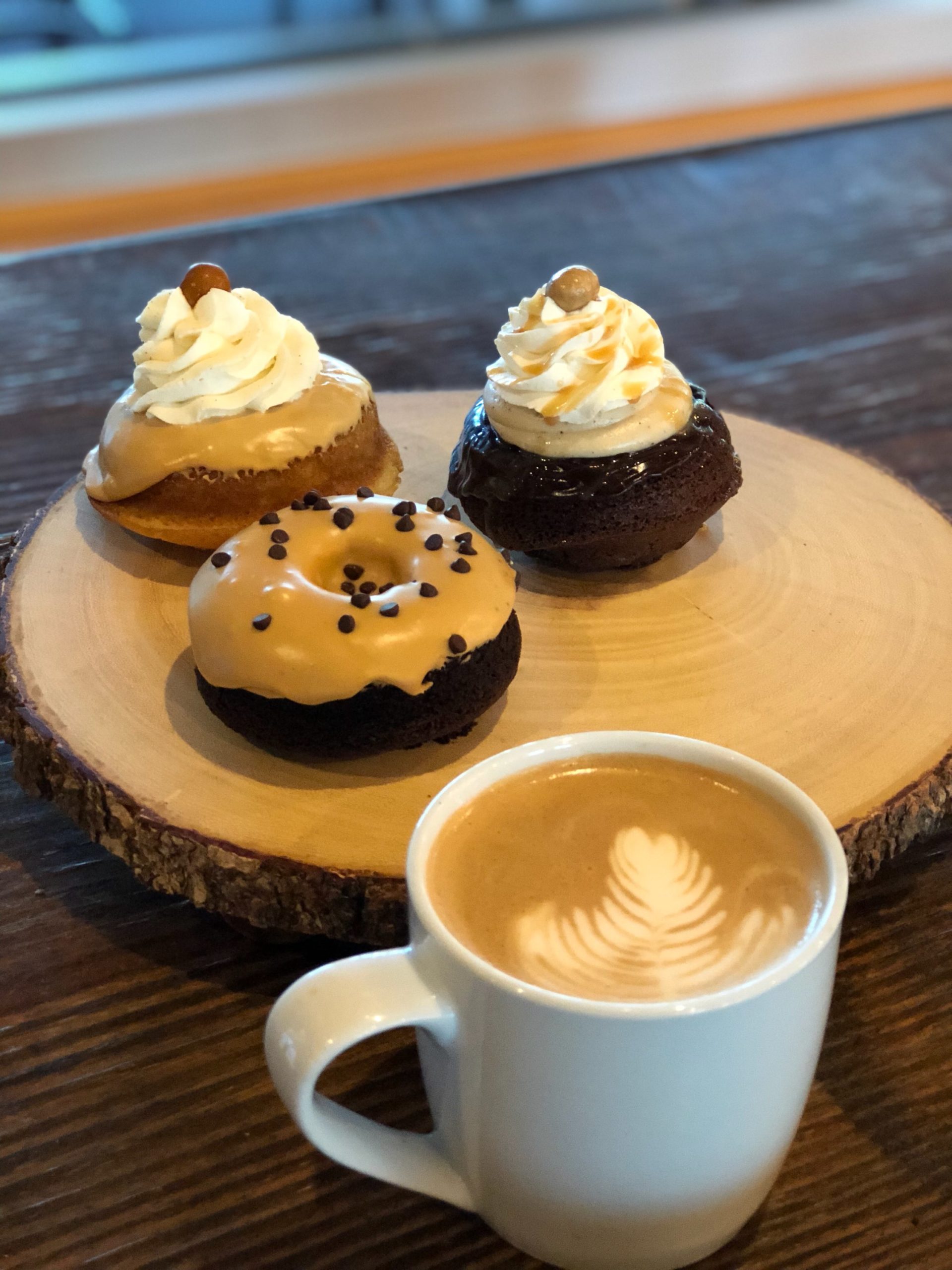Plate of gourmet donuts and specialty coffee