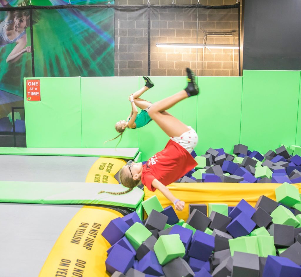 Kids jumping in the air at the indoor trampoline park