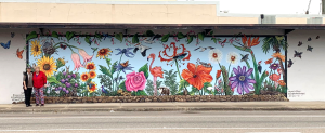 a floral mural on the side of a building