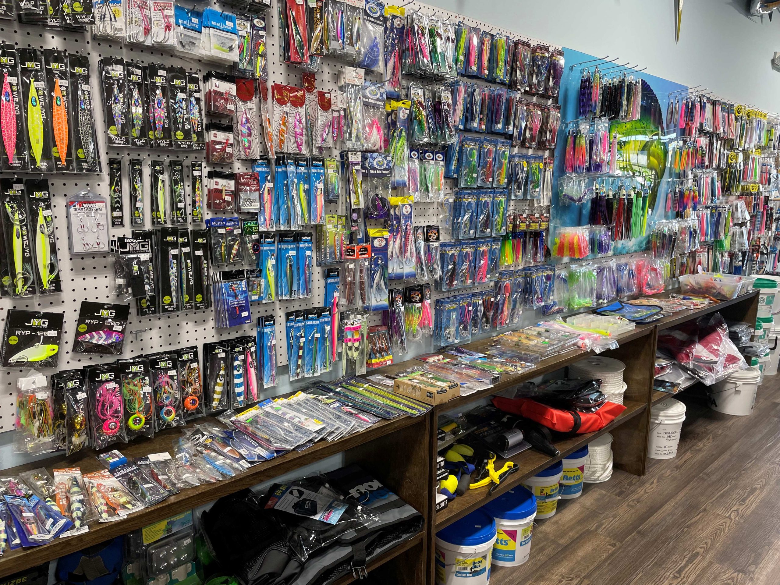 Shop of fishing supplies long wall of bait and tackle