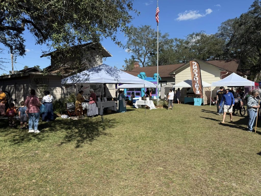 Outside of the Middleburg Museum pictured a bounce house and vendor tents with people walking around