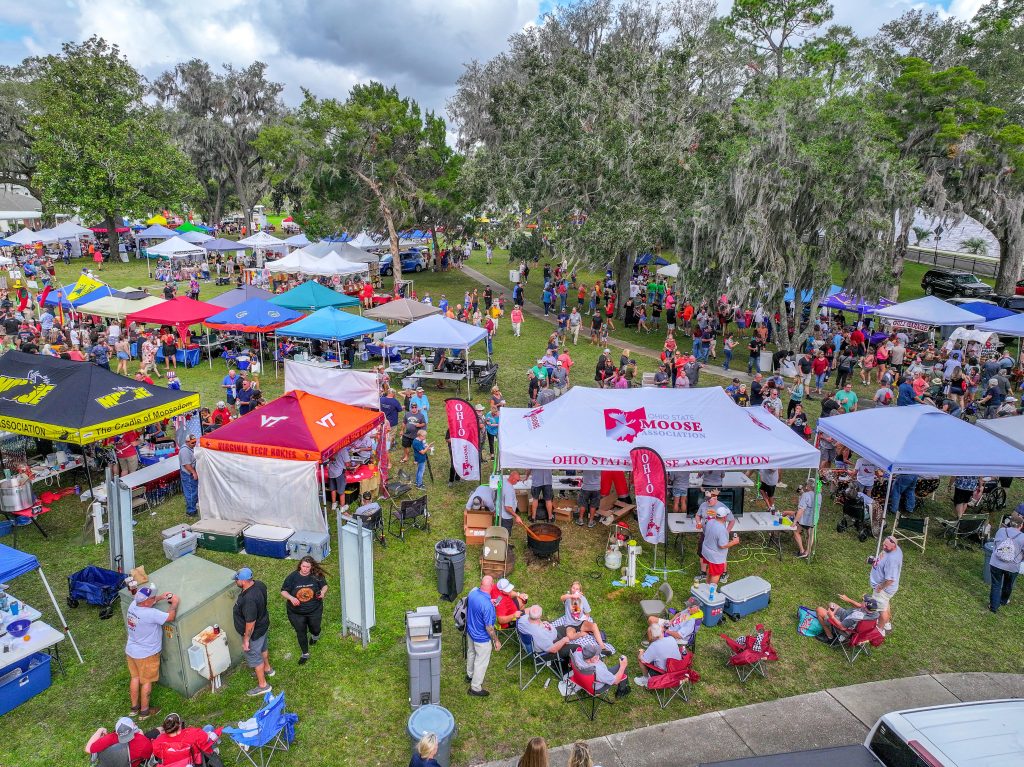 Arial photo showing large group of people and event tents.