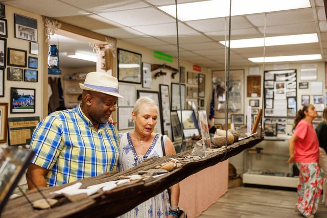 Couple observing museum pieces at the Middleburg Museum