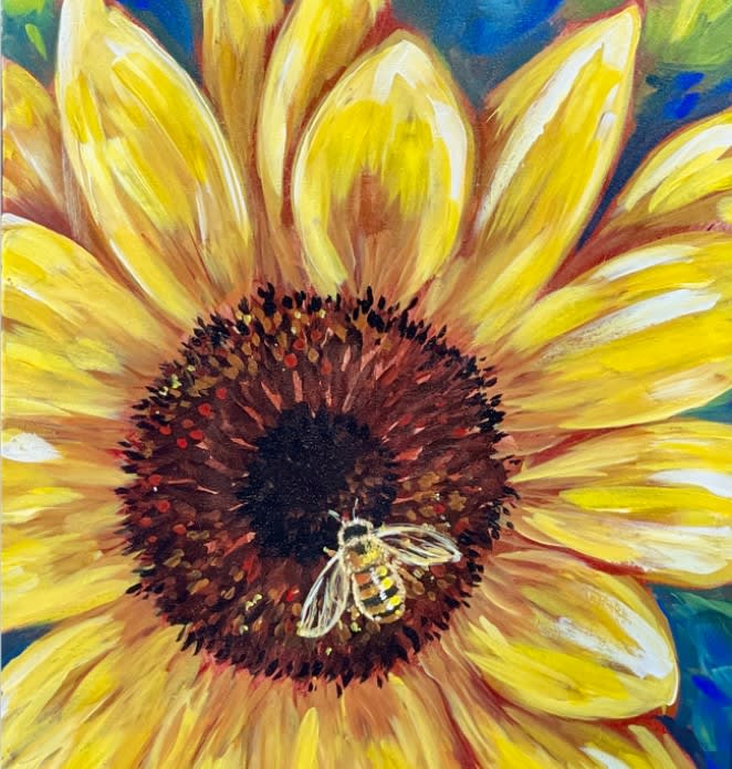Painted sunflower with a bee in the center.