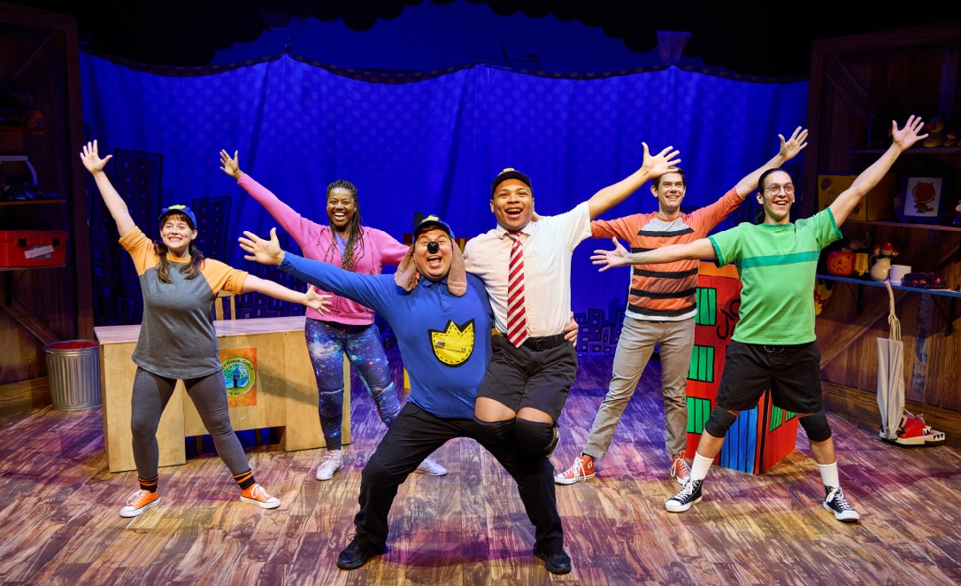 Dog Man Feature Photo Cast members on stage.