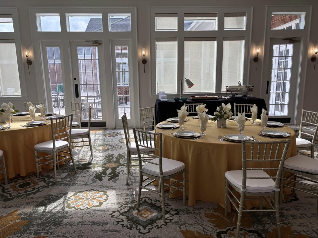 indoor venue with tables set up for a wedding reception