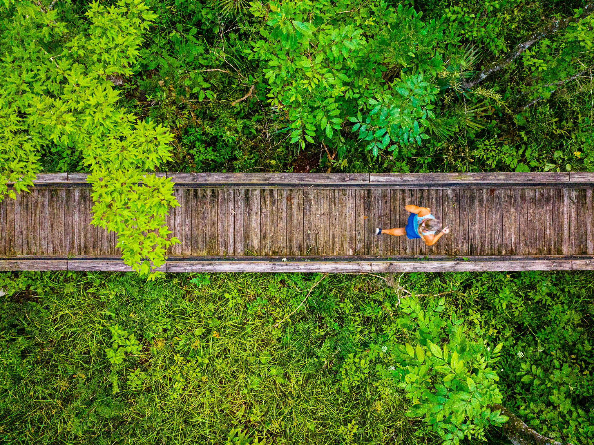 Woman Running on Trail