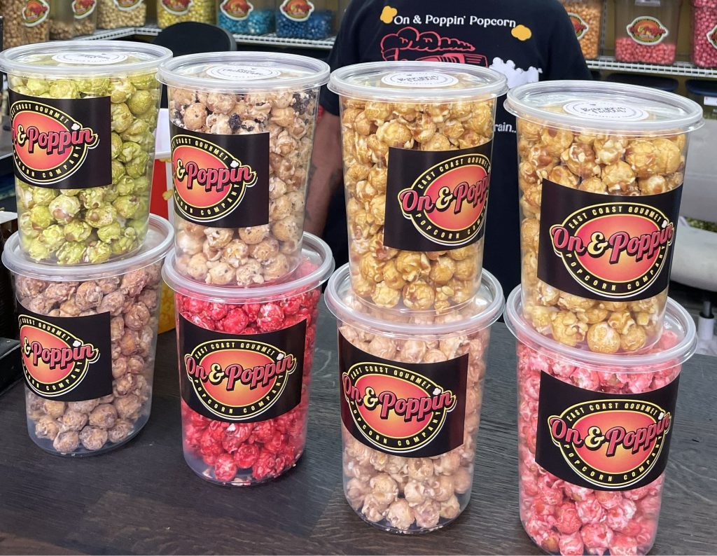 Series of eight popcorn flavors in plastic buckets available for purchase